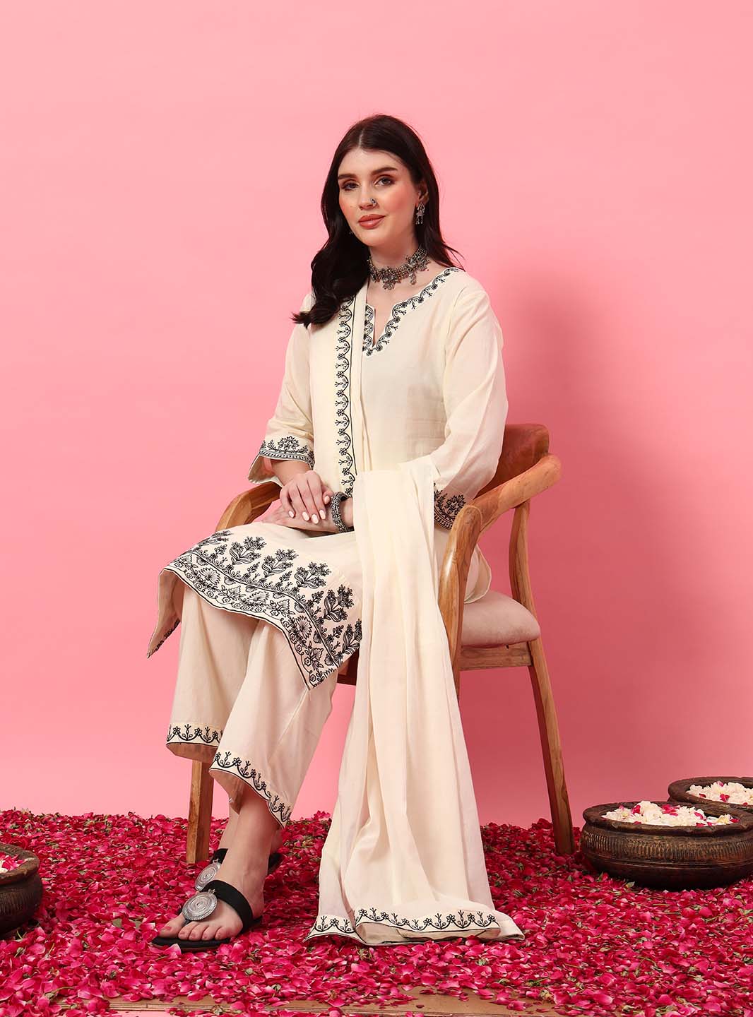 Model in Mahukaa's kurti set – off-white straight kurta pant set with intricate embroidery